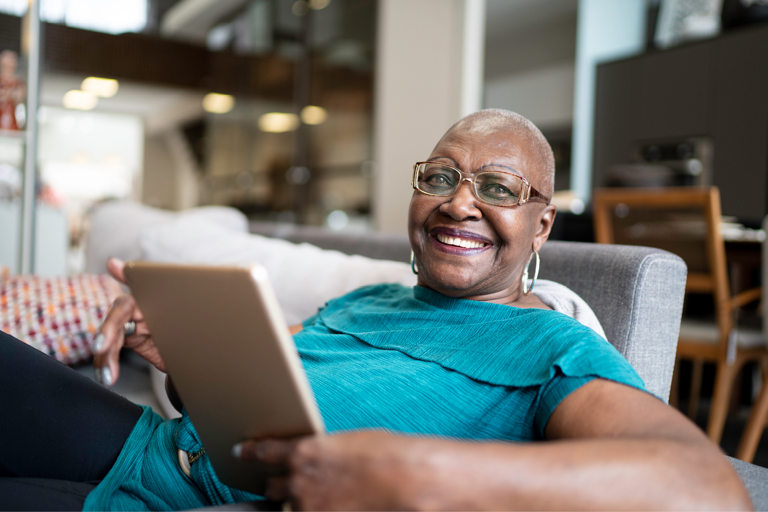 Portrait of a senior woman using tablet at home