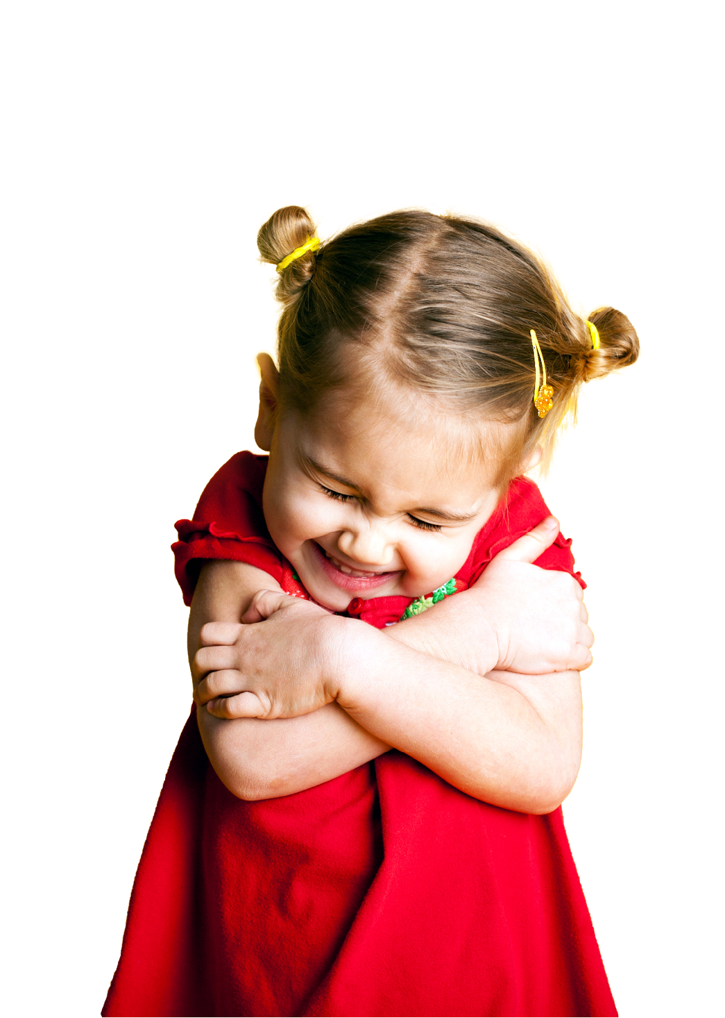 Color image of a little girl giving herself a big Valentine hug with hearts in the background on yellow  